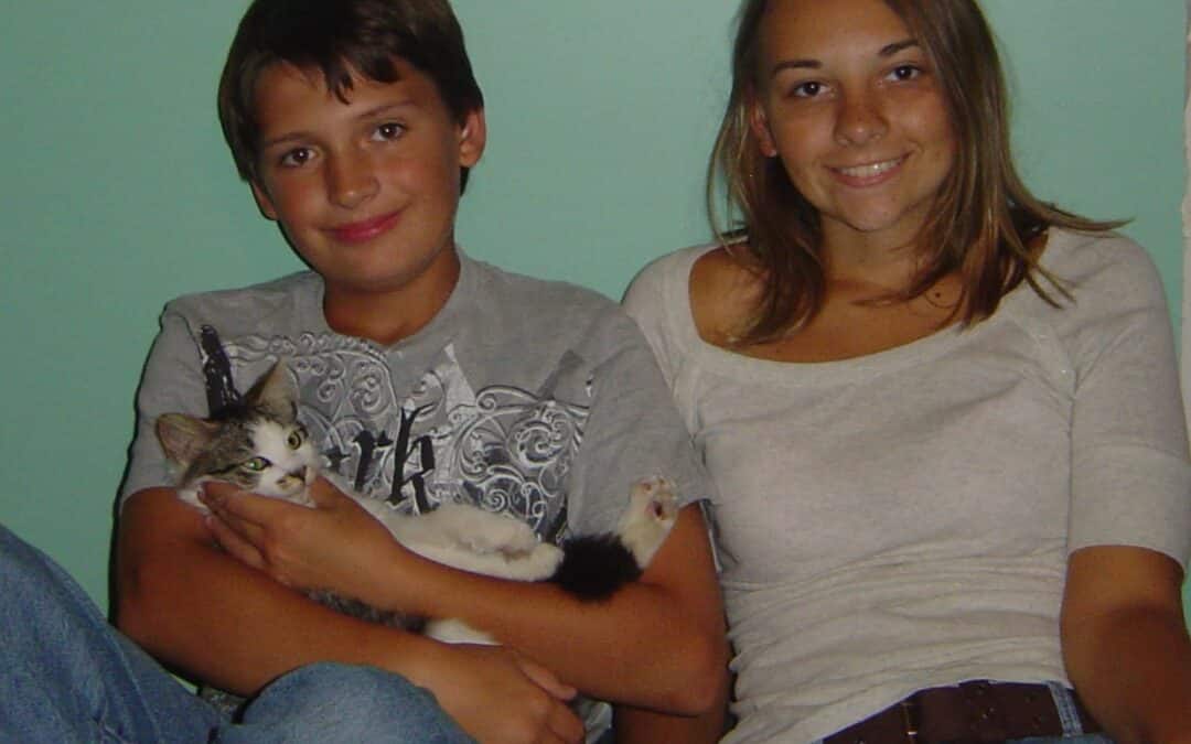 Luke Yuzwa & his step-sister, Jessica, with their cat, Kayley.