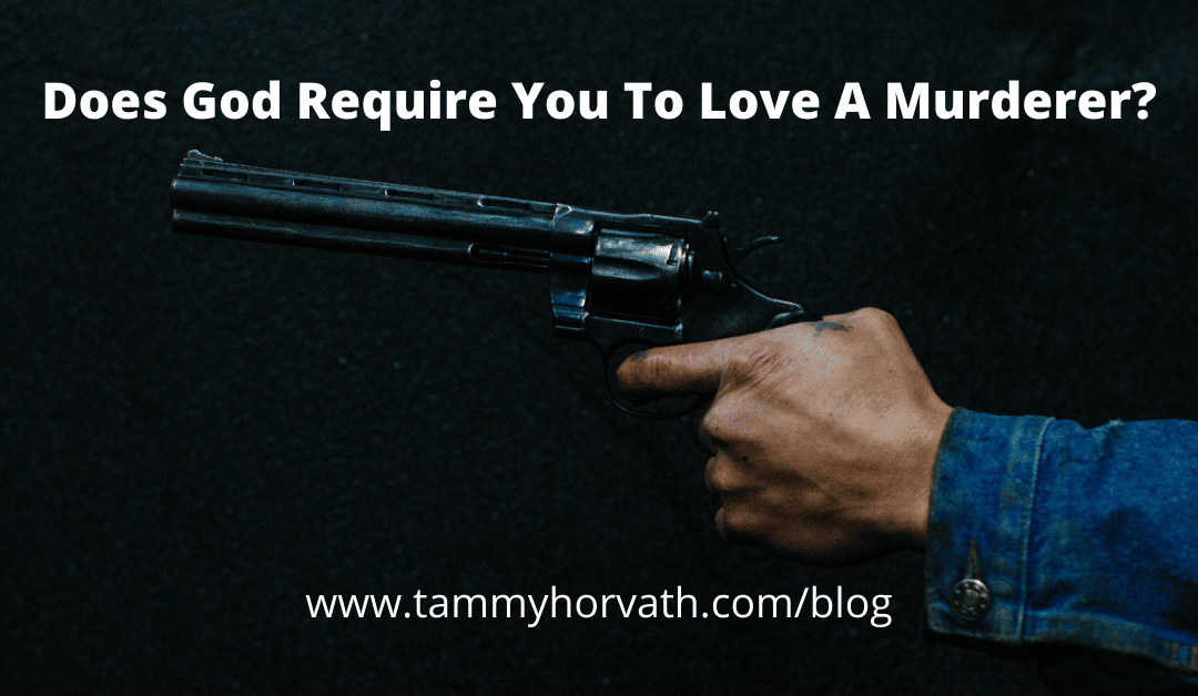 man holding gun - Does God require you to love a murderer
