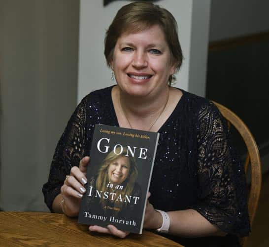 Tammy Horvath holding her book Gone in an Instant