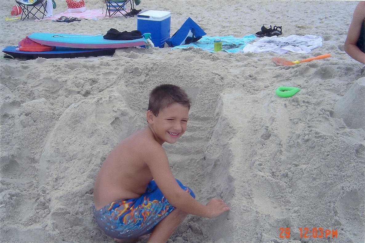 Luke Yuzwa playing in sand in the Outer Banks, North Carolina Luke Yuzwa playing in sand in the Outer Banks, North Carolina