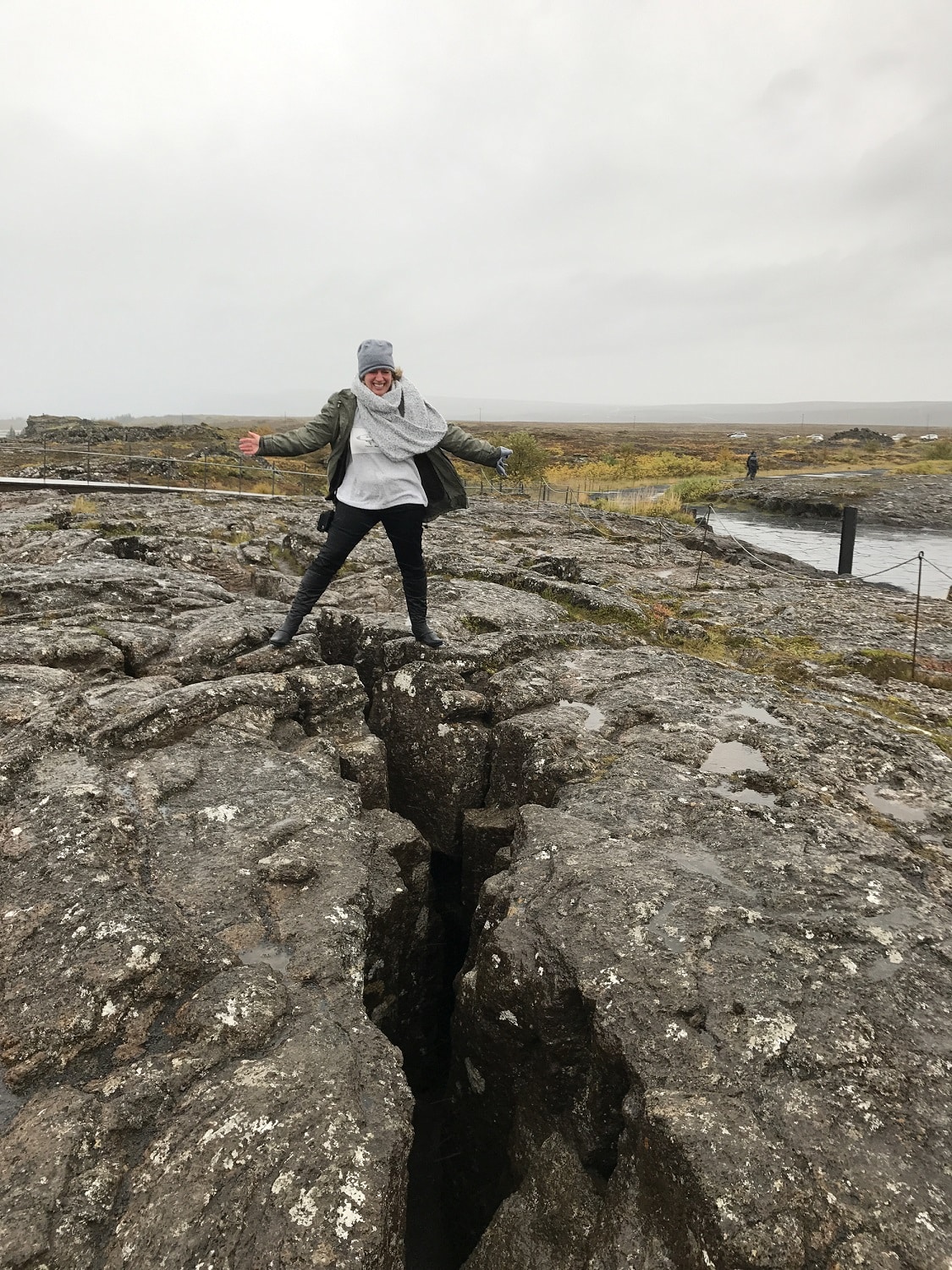 Tammy-Horvath-in-Iceland-over-tectonic-plates Tammy Horvath in Iceland standing over the enormous crevice where the Eurasian and North American tectonic plates meet